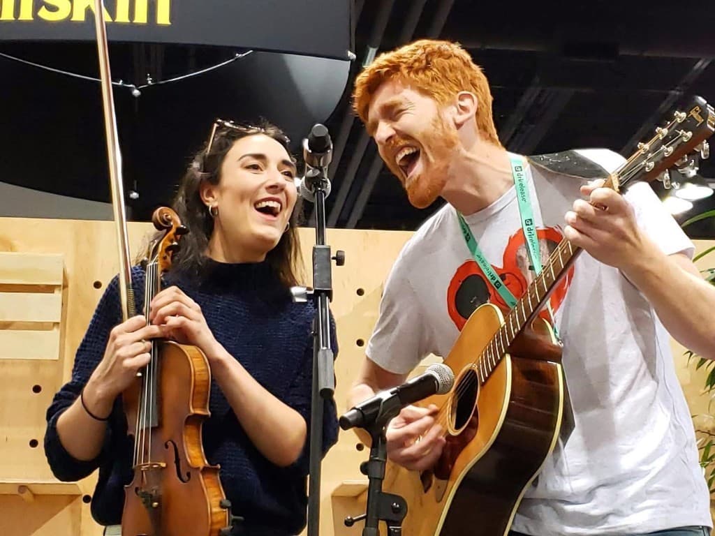Sarah and Ben performing violin and guitar live
